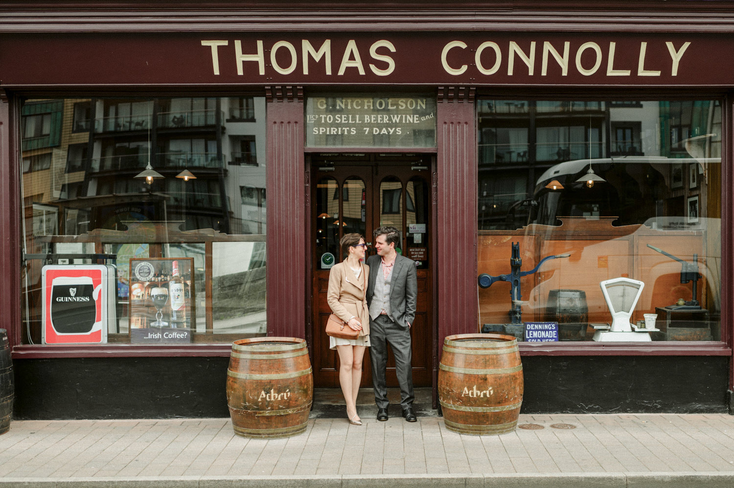 elske & Sean at the front of thomas connolly pub in sligo city at their wedding day