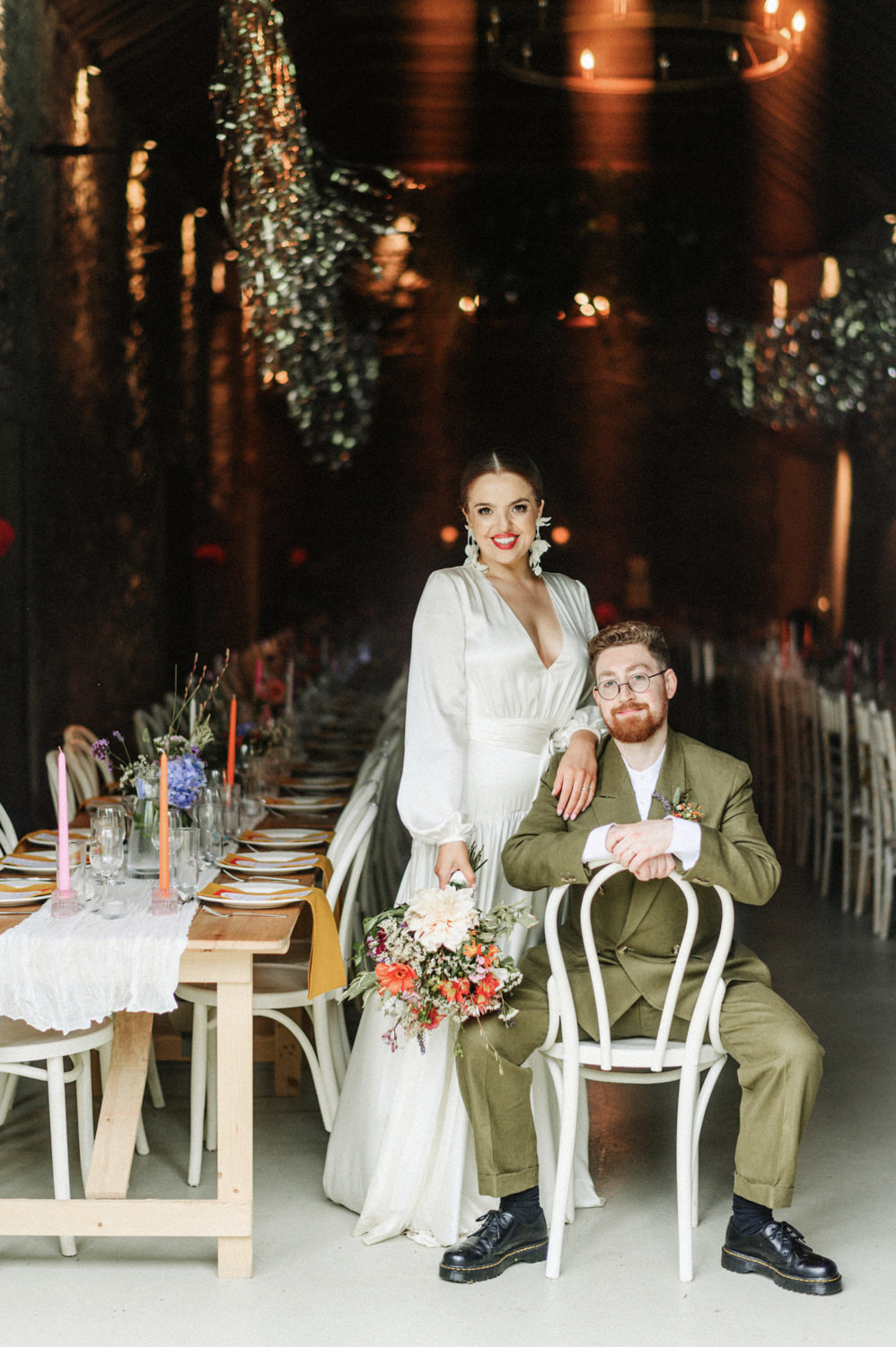 Bride and groom posing at their wedding reception in Juniper Barn, Sligo, with rustic décor.