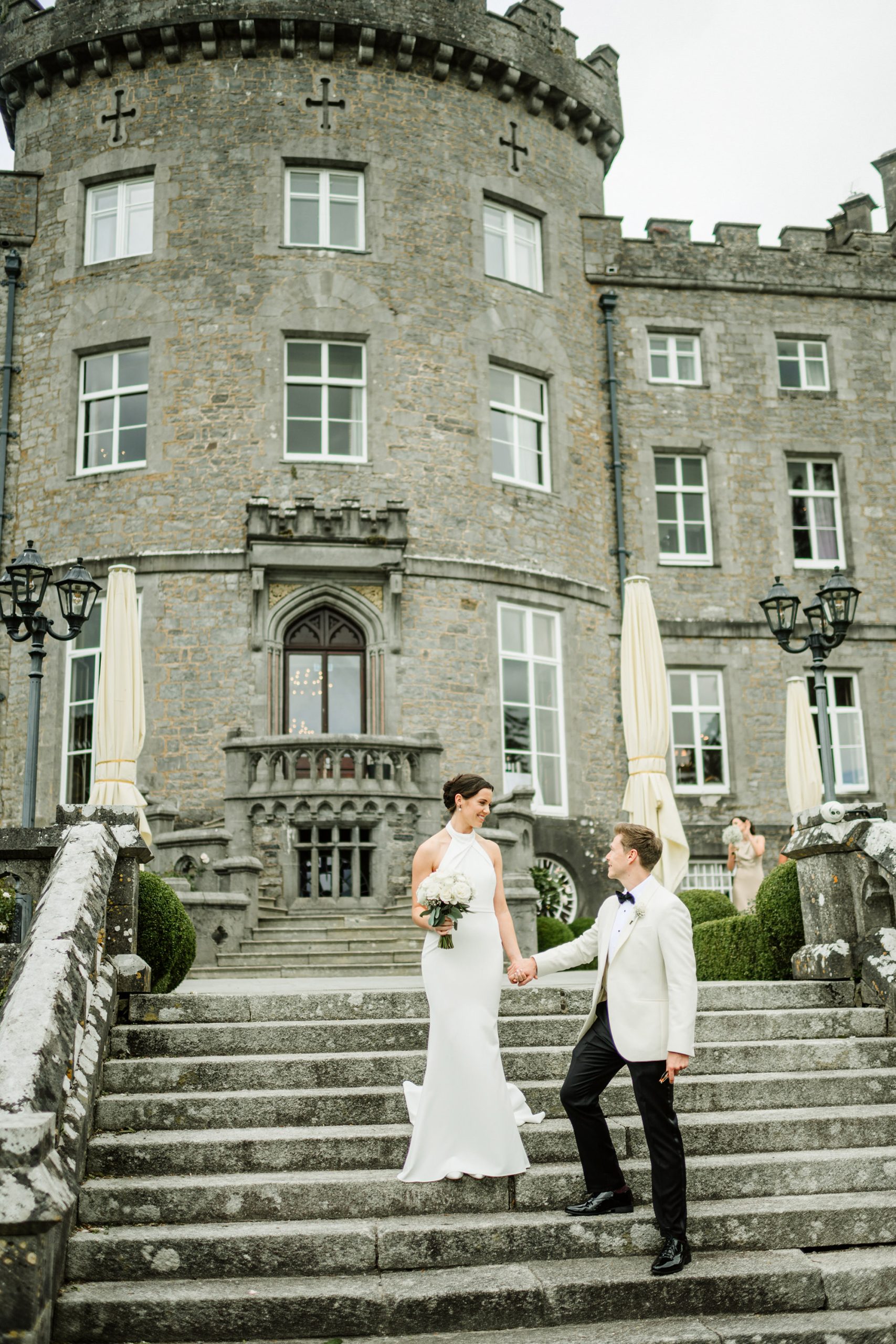 elegant bride and groom walking down the stairs to markree garden