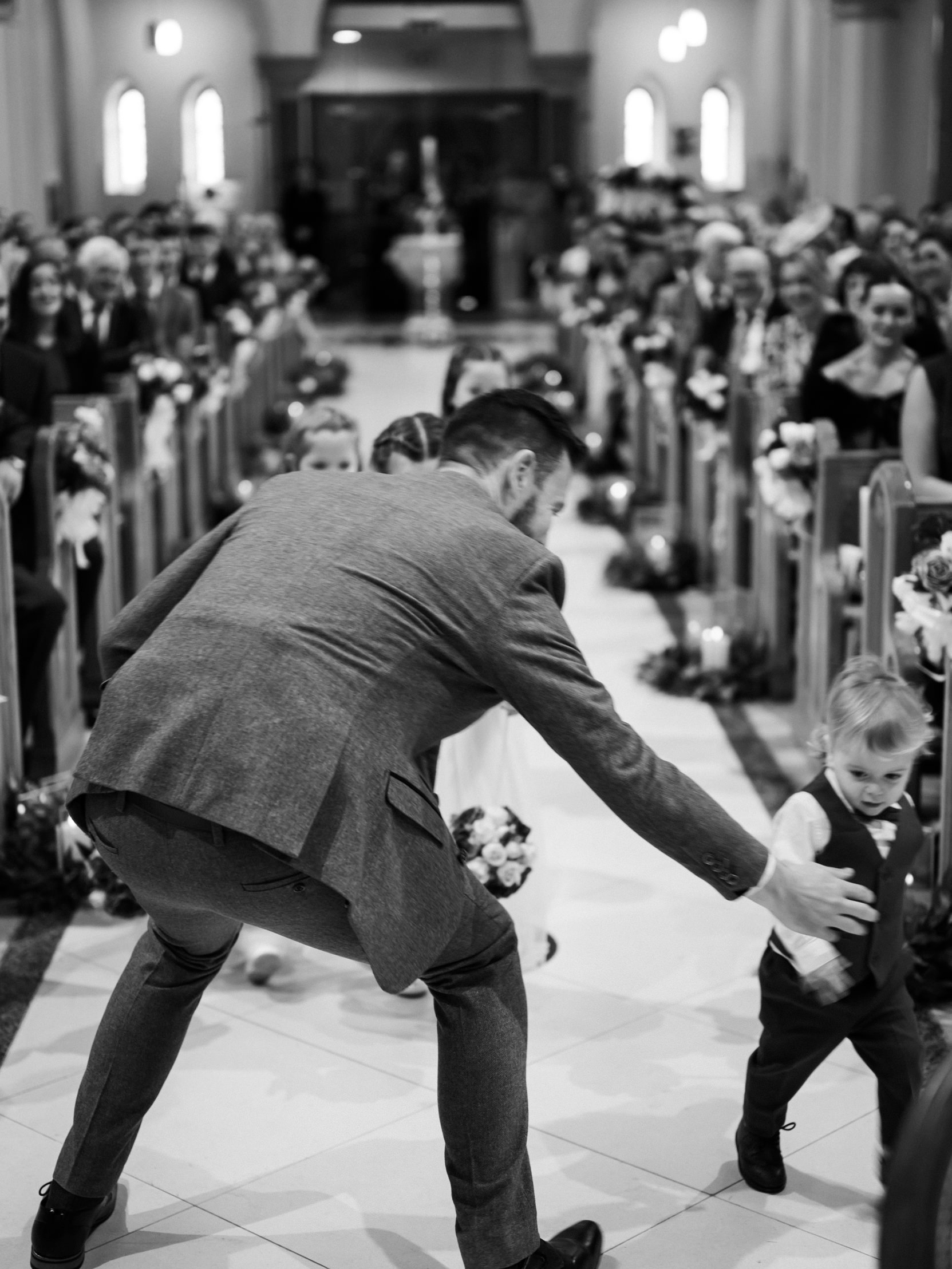 groom at the church with page boys