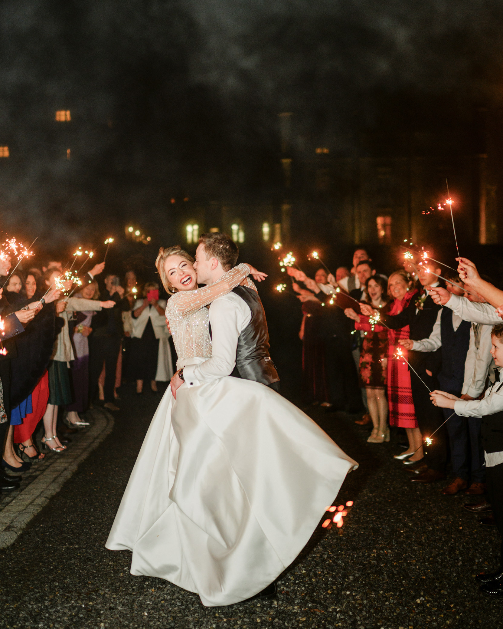 Kilronan Castle wedding couple celebrating with sparklers, Roscommon Ireland