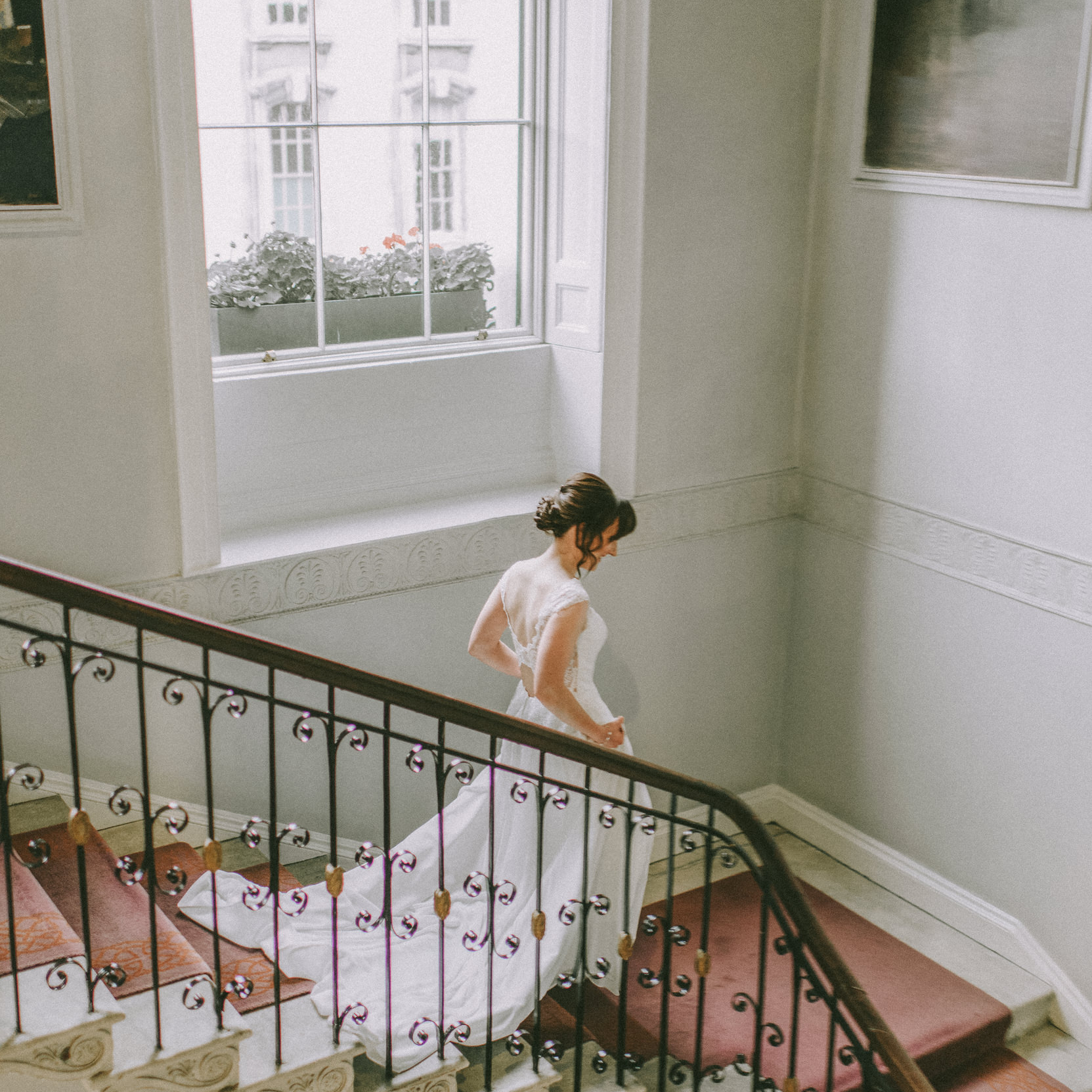 bride walking down the stairs in merion hotel